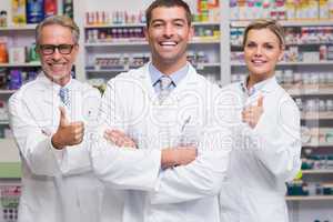 Team of pharmacists smiling at camera