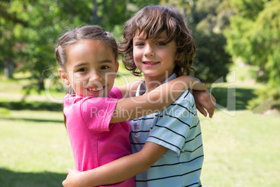 Little siblings hugging each other