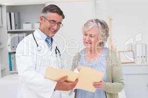 Doctor and patient discussing over reports