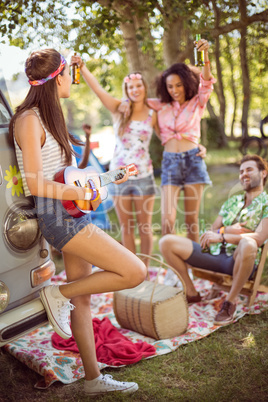 Hipsters having fun in their campsite