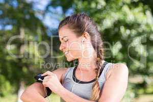 Fit brunette on a run in the park