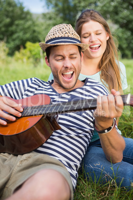 Cute couple relaxing in the park