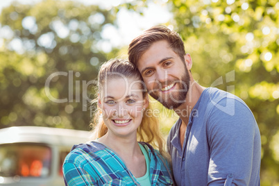 Hipster couple smiling at camera