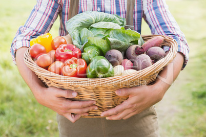 Farmer carrying basket of veg