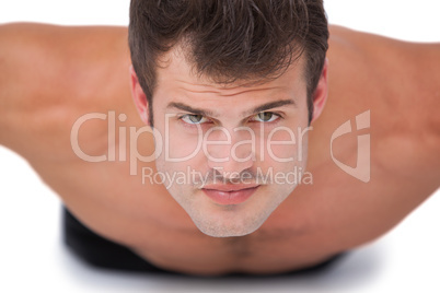 Fit shirtless man doing push ups