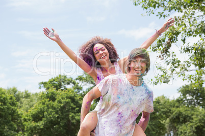 Young friends having fun with powder paint