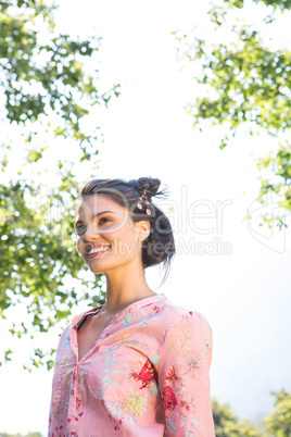 Pretty brunette smiling in park