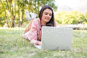 Woman using laptop in park