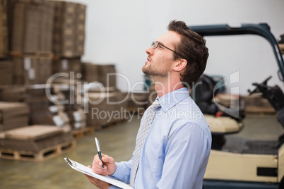 Warehouse manager checking his inventory