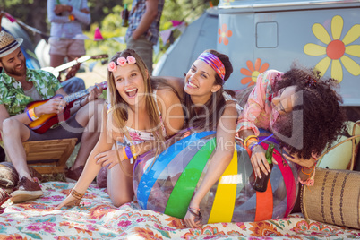 Happy hipsters having fun on campsite