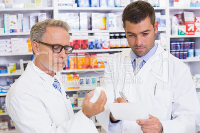 Pharmacist looking a medication for a prescription