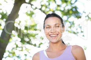 Happy young woman in the park