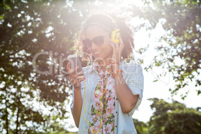 Pretty hipster using her smartphone