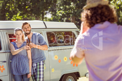 Hipster friends posing and drinking