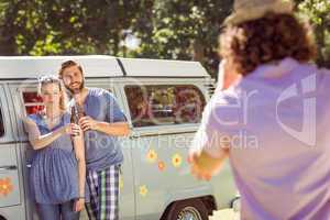 Hipster friends posing and drinking