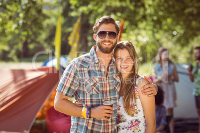 Hipster friends chatting on campsite