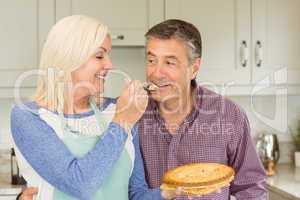 Happy mature blonde feeding pie to husband