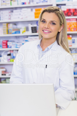 Smiling pharmaacist looking at camera