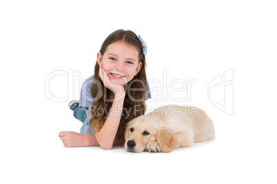 Lying little girl with a dog