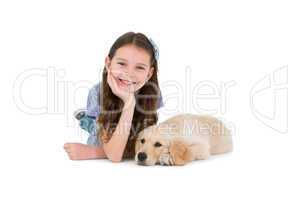 Lying little girl with a dog