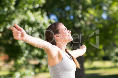 Fit brunette in the park