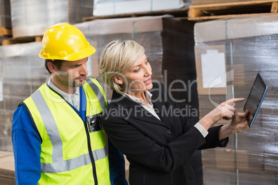 Warehouse worker and manager using tablet pc