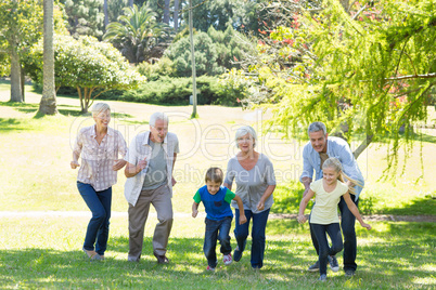 Happy family running in the park