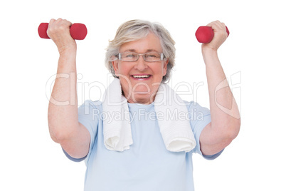 Senior woman lifting hand weights