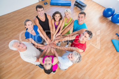 Portrait of fit people stacking hands
