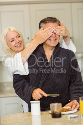 Mature couple having breakfast together