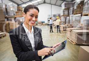 Smiling manager using digital tablet