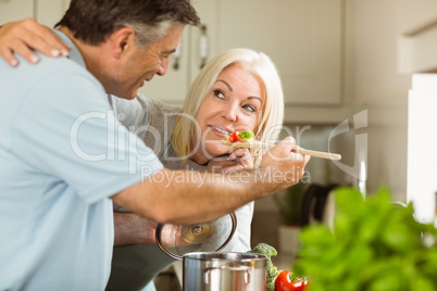 Mature couple preparing vegetarian meal together