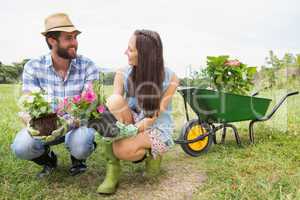 Happy young couple gardening together