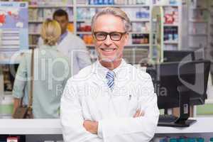 Smiling pharmacist looking at camera