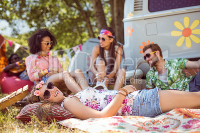Happy hipsters relaxing on the campsite Happy hipsters relaxing on the campsite