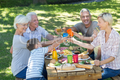 Happy family having picnic in the park