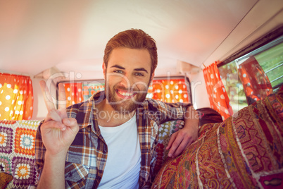 Hipster on road trip in camper van