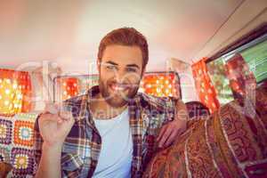 Hipster on road trip in camper van