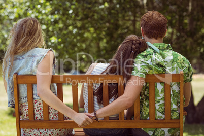 Young man holding hand of wrong girl