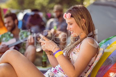 Pretty hipster sending text message