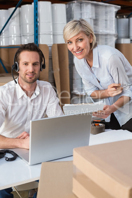 Warehouse team smiling at camera