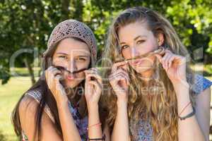 Pretty friends smiling at camera