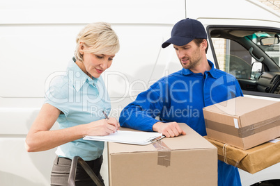 Happy delivery man with customer