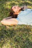 Young man lying down in the park