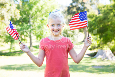 Little girl waving american flag