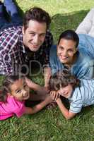 Happy family smiling at camera