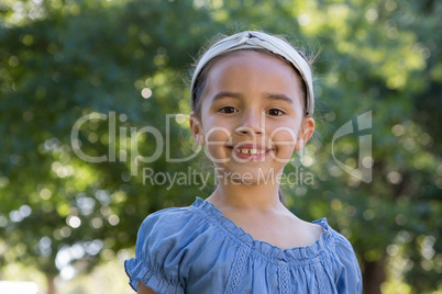 Happy little girl smiling at camera