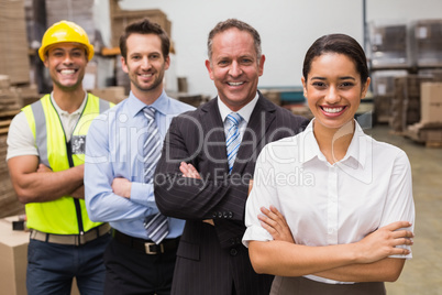 Warehouse team smiling at camera