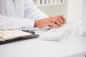 Doctor typing on keyboard and