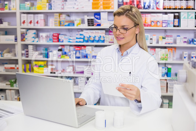 Pharmacist using the computer